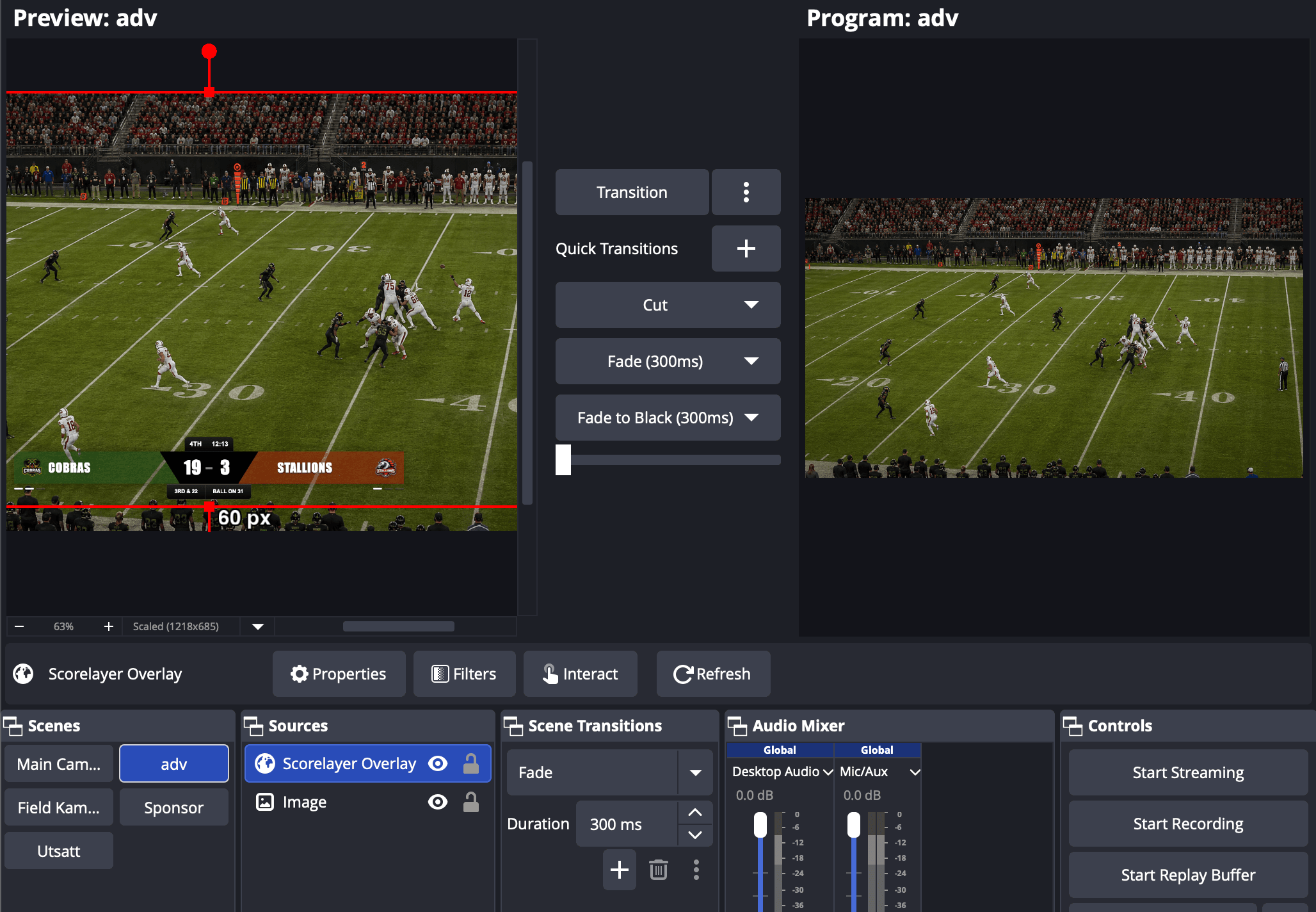 OBS preview showing a football field with the ScoreLayer scoreboard overlay active